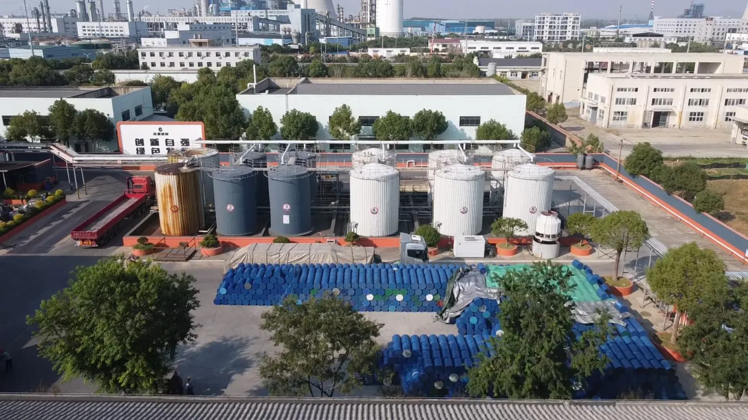 Aerial view of large-scale raw material storage tanks at the Changyuan New Materials facility