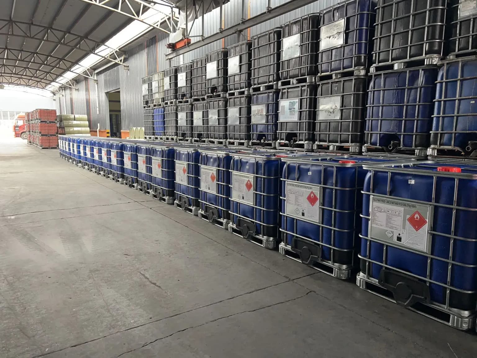 Neatly stacked and labeled barrels of finished unsaturated polyester resin products